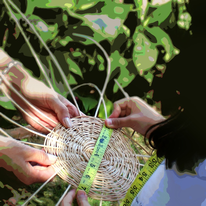141028 Katya measuring the diameter of the circular basket weave