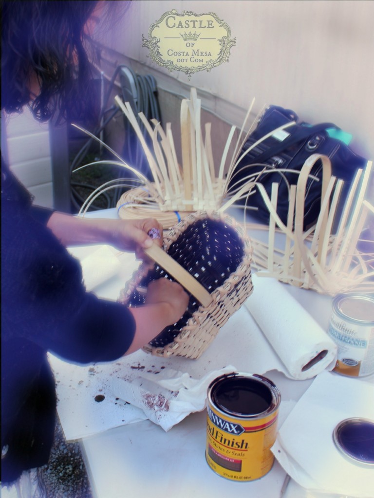 141103 Gloria varnishing her handmade woven reed wine basket with Minwax 2