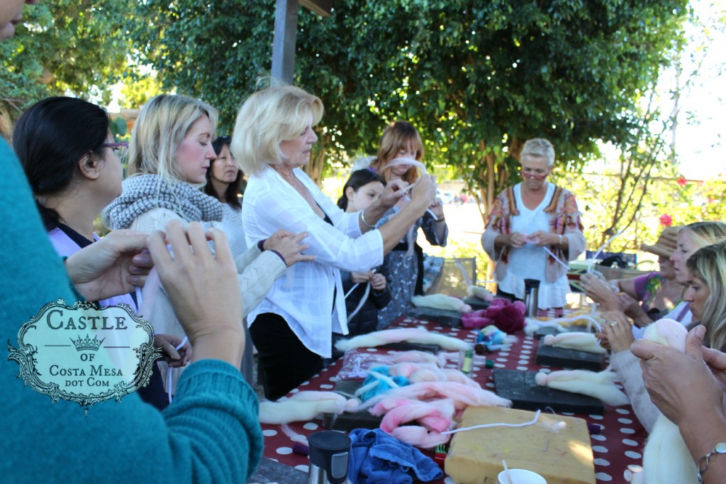 141117 Christine Newell teaching craft group to wrap wool roving for making doll hands.