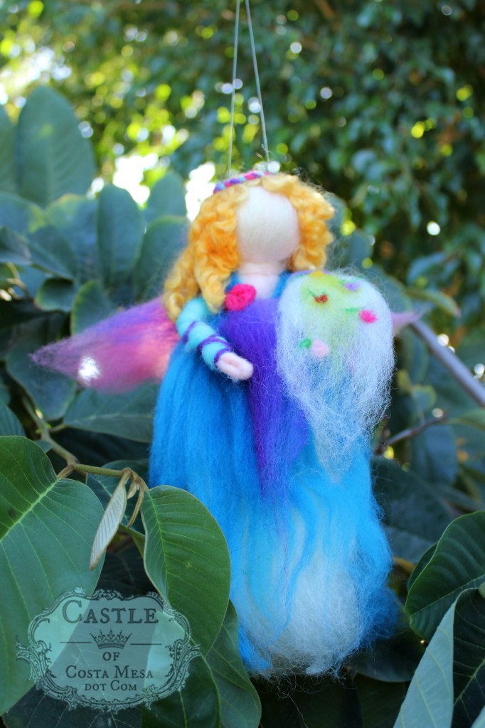 141117 Erica's blonde curly haired wool roving spring fairy mobile with cornucopia of flowers.