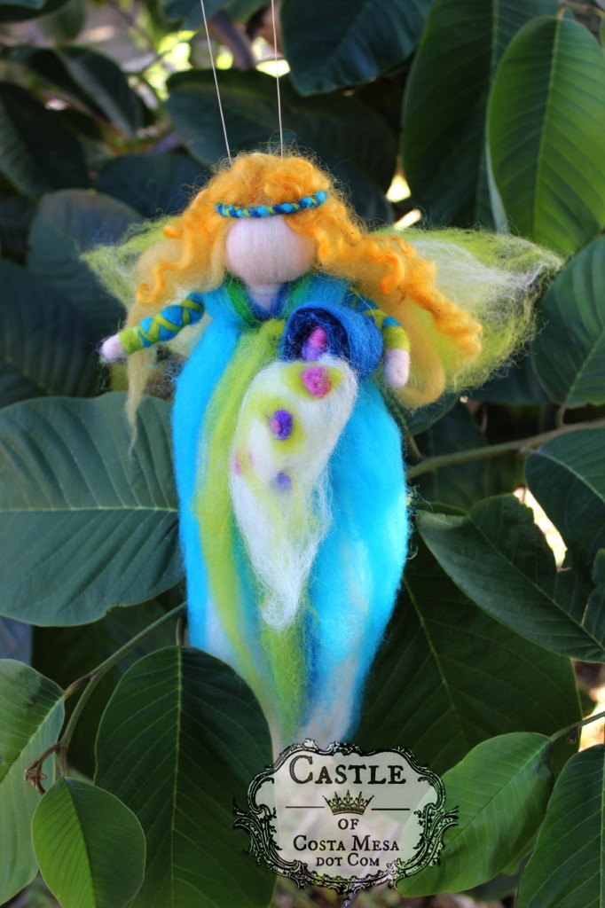 141117 Kathy's pulled wool magic fairy angel with cornucopia of plenty spewing spring flowers.