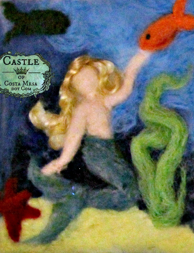 141130 Blonde Mermaid petting a fish needle-felted wool picture by Castle of Costa Mesa.
