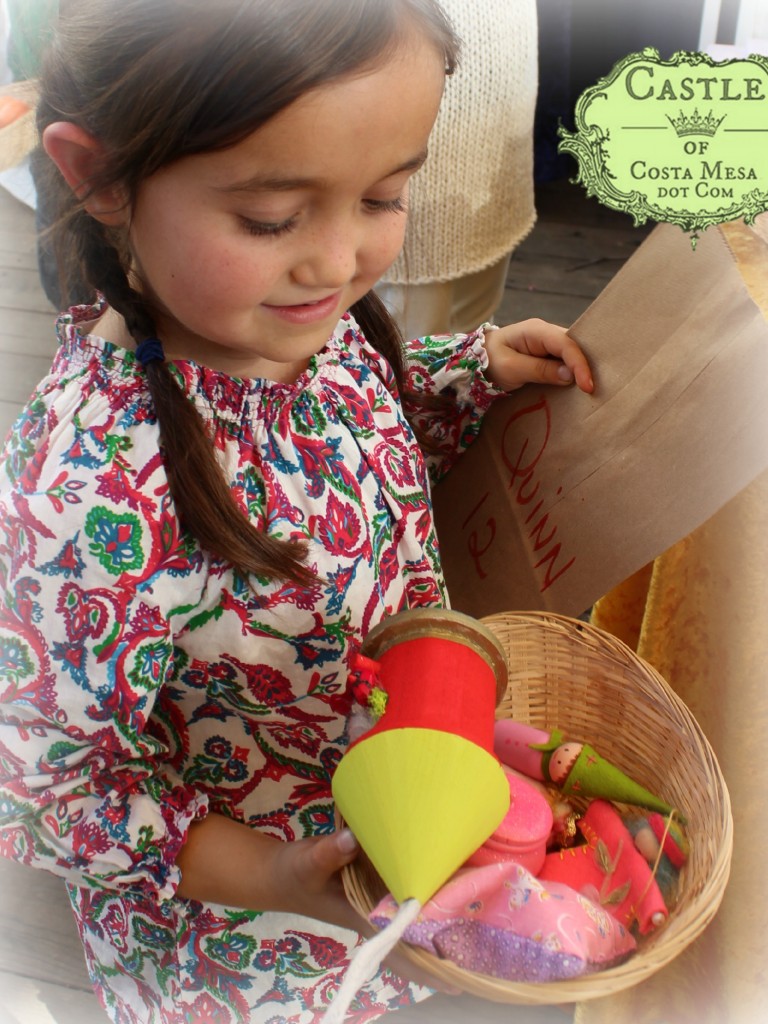 141208 Quinn with basketful of handmade treasures Renuka's peg doll.