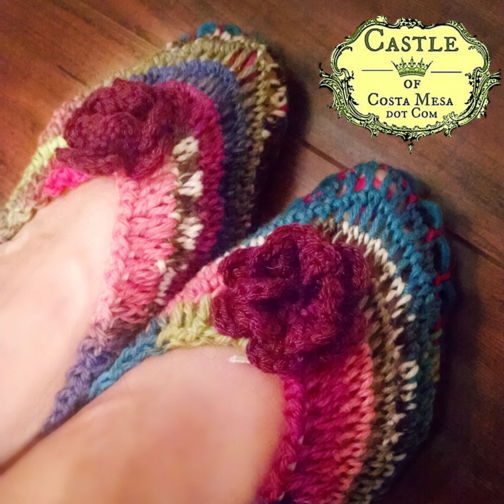 150915 Christine Newell feet wearing crochet handmade slippers with felt soles and crochet flower decoration